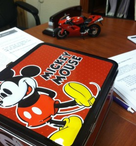 I have a lunchbox and a motorcycle on my desk!